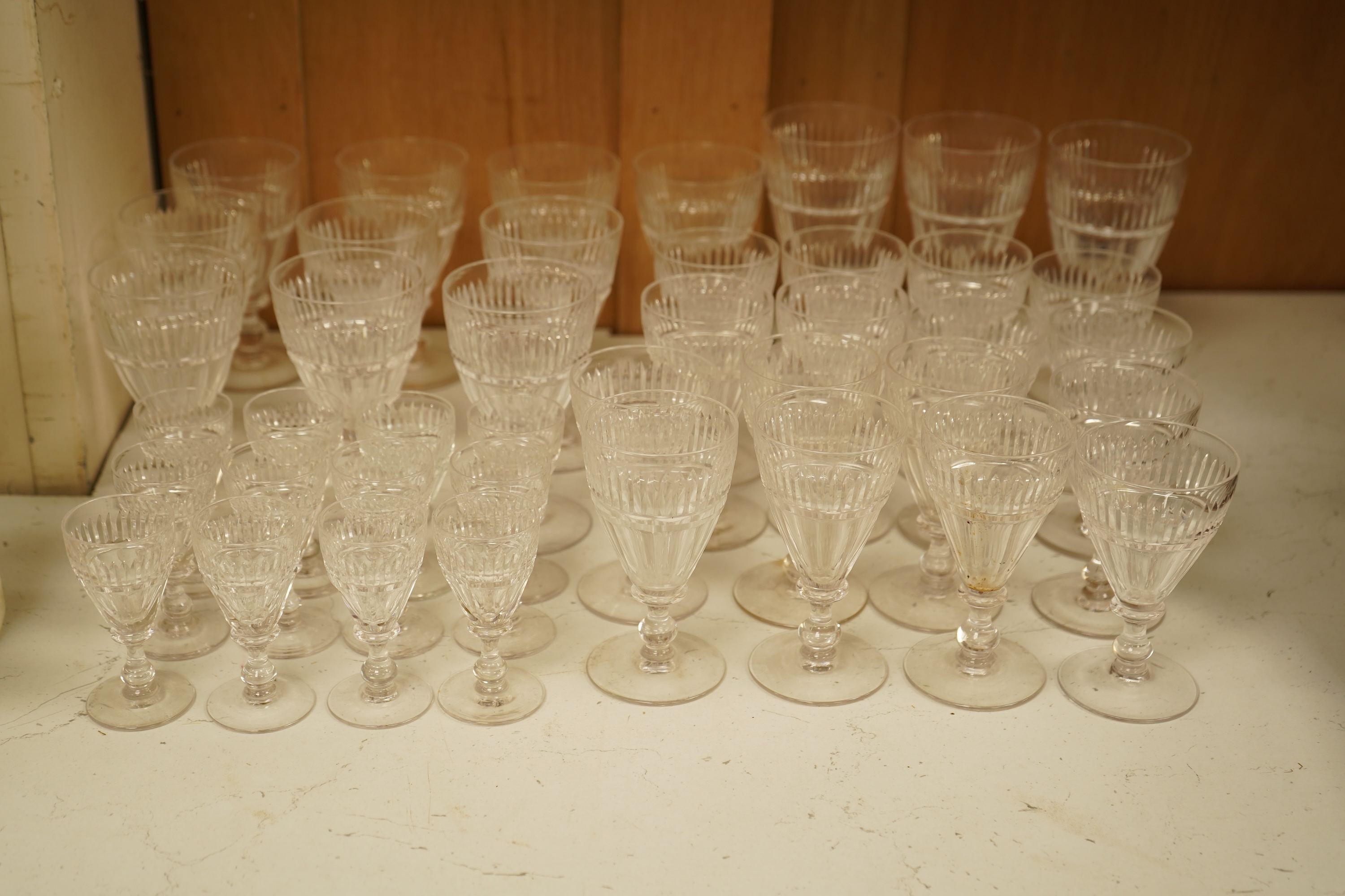 A part suite of 19th century cut glass drinking glasses, largest 13cm high